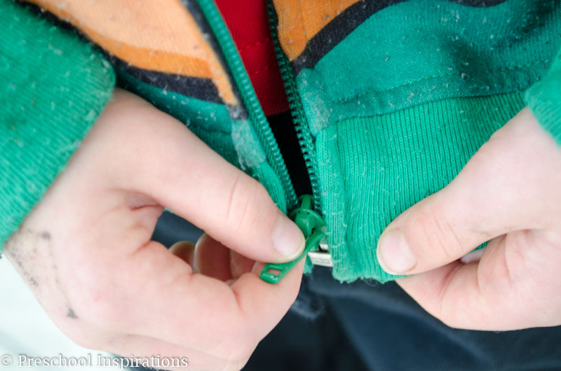 Teaching children how to zip their coats