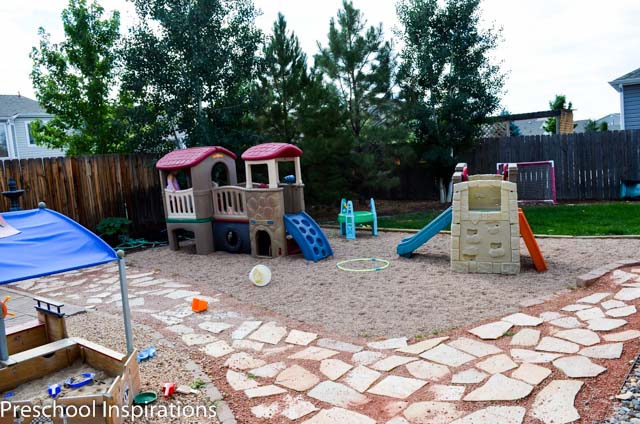 This is the outside play area for my in home preschool with climbers, a sand box, and grassy area. We also have a greenhouse.