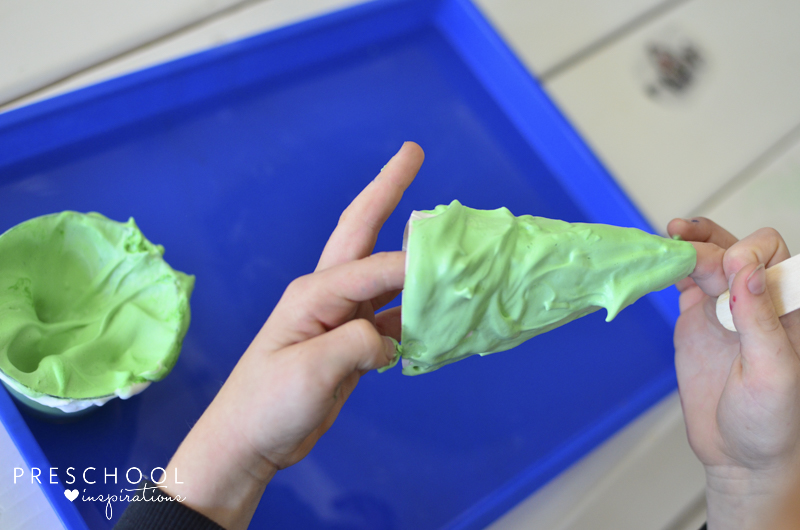 Painting the puffy paint Christmas tree