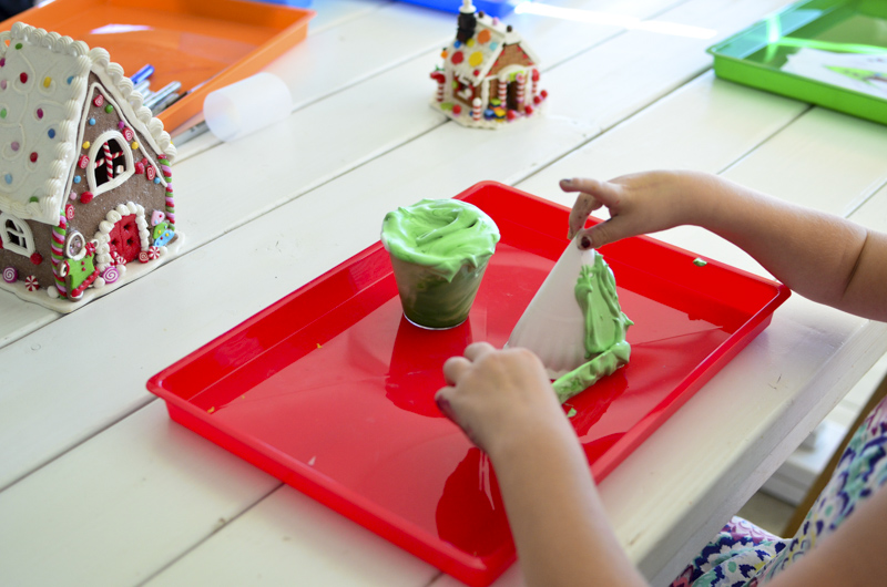 paper plate Christmas tree with puffy paint set up