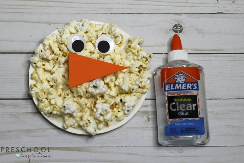 Make a popcorn paper plate snowman craft with the kids this winter