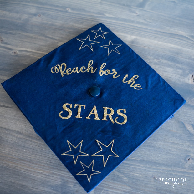 graduation cap with the cricut-made text 'reach for the stars' and six stars on it 