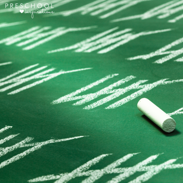 tally marks written in chalk on a green chalkboard